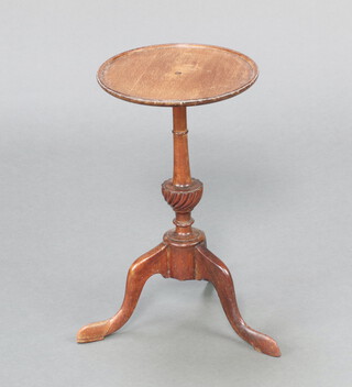 A Georgian style circular mahogany kettle stand raised on bulbous turned tripod column and tripod base 46cm h x 26cm diam. 