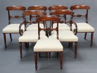 A set of 7 Georgian mahogany bar back dining chairs with carved mid rails and overstuffed seats, raised on turned and fluted supports, comprising 2 carvers 87cm h x 63cm w x 48cm d and 5 standard chairs 87cm h x 49cm w x 45cm d  