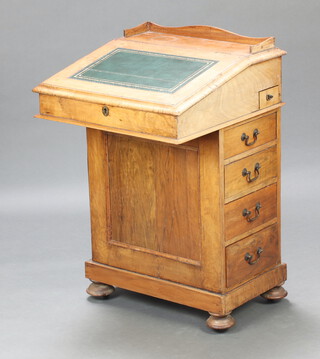 A 19th Century heavily sun bleached mahogany Davenport desk with 3/4 gallery, green inset writing surface, the pedestal fitted an inkwell drawer and 4 drawers with brass swan neck drop handles, raised on bun feet 88cm h x 56cm w x 57cm d 
