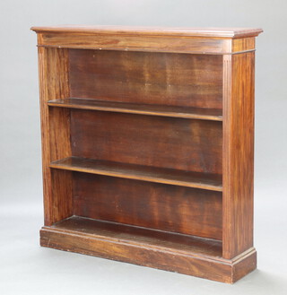 A Victorian style bleached mahogany open bookcase fitted adjustable shelves, raised on a platform base with fluted columns to the side 122cm h x 122cm w x  31cm d
