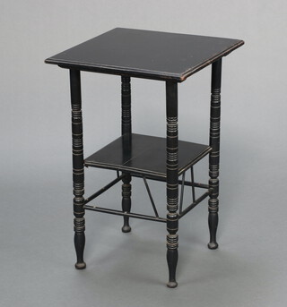 An Art Nouveau ebonised 2 tier occasional table in the manner of E W Godwin, with spindle decoration to the base 65cm h x 43cm w x 43cm d 