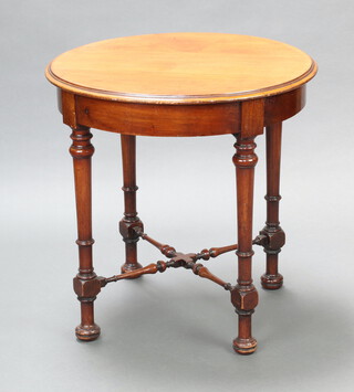 A circular Victorian bleached mahogany occasional table raised on turned supports with X framed stretcher 76cm h x 75cm diam. 