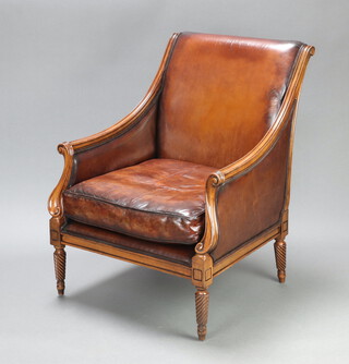 A French style mahogany show frame armchair, the seat and back upholstered in brown leather, raised on turned supports 97cm h x 77cm w x 64cm d (seat 39cm x 41cm) 