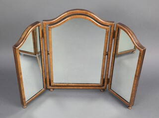 A Queen Anne style arched triple plate dressing table mirror contained in a walnut frame, raised on bun feet 65cm h x 59cm w 