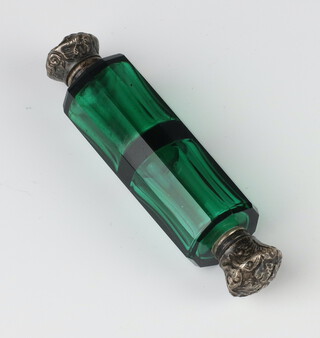 A Victorian green glass double ended scent with repousse covers 9cm 