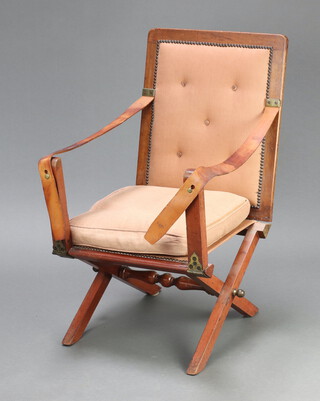 An Edwardian mahogany and leather folding campaign chair, raised on an X framed supports with brass and iron furniture 91cm h x 52cm w x 50cm d (seat 24cm x 27cm) 
