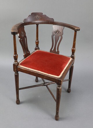 An Edwardian carved mahogany slat back corner chair with upholstered seat, raised on turned supports and X framed stretcher 73cm h x 56cm w x 58cm d (seat 23cm x 32cm) 