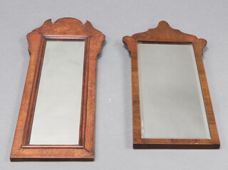 A rectangular plate mirror contained in a walnut frame 76cm h x 30cm, together with a similar bevelled plate mirror contained in a walnut frame 69cm x 26cm 