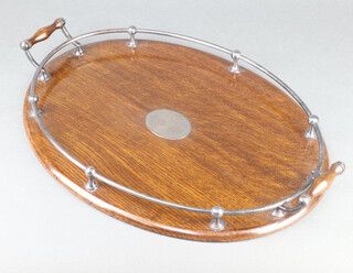 An Edwardian oak oval tray with silver plated gallery 57cm 