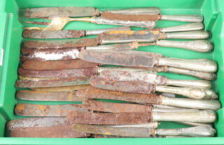 A quantity of Continental knives with white metal handles 