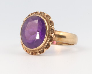 A yellow metal oval amethyst ring, size P, 4 grams gross 