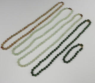 A Chinese white metal hardstone set bracelet, 4 hardstone necklaces, a bracelet and brooch 