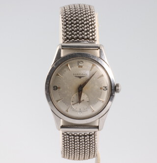 A gentleman's vintage steel cased Longines wristwatch with seconds at 6 o'clock, the case numbered 6402/3/100, the movement numbered 9108560/23Z, contained in a 33mm case on a steel mesh bracelet 