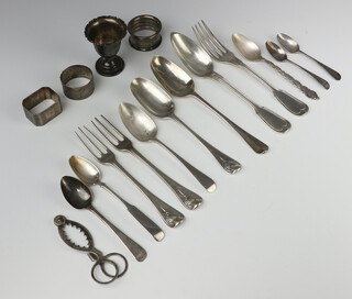 A Georgian silver table spoon and minor silver cutlery, 3 napkin rings, egg cup, weighable silver 414 grams 