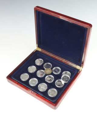 Thirteen commemorative silver crowns, each 28 grams, together with a 1935 crown, contained in a box 