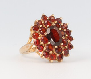 A yellow metal 9ct garnet cluster ring, 4 grams, size I 1/2