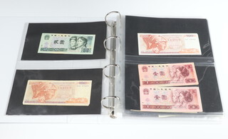 A quantity of world bank notes, contained in a folder 