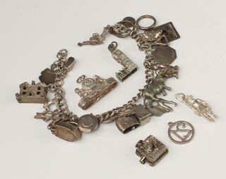 A silver charm bracelet and 5 charms, 71 grams 