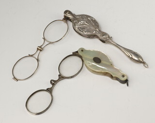 A repousse silver plated Art Nouveau lorgnette together with a mother of pearl ditto 