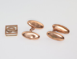 A pair of 9ct yellow gold cufflinks and a 9ct yellow gold clip, 7 grams 