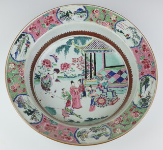 A 19th Century Qing Dynasty famille rose deep bowl, the interior decorated with a scholar and female attendants beside a sedan chair before a pavilion terrace, the rim with landscape and figure panels on a ground of peony 9cm h x 37cm diam.  