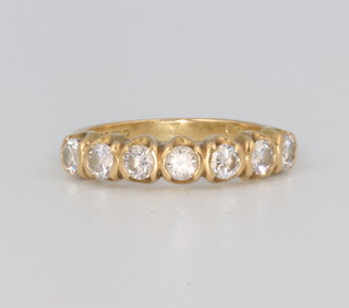 An 18ct yellow gold 7 stone diamond ring, approx. 0.70ct, size I 1/3, 3 grams 