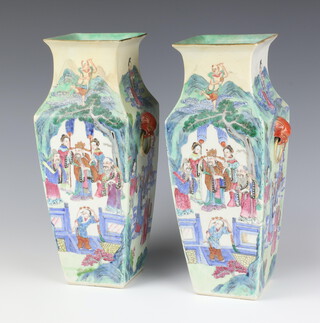 A pair of 19th Century Qing Period Cantonese square tapered vases with red and gilt lion mask ring handles, decorated a continuous scene with a dignitary in a garden with attendants and immortals, the immortals standing on swirling clouds in a mountainous landscape 30.5cm h 