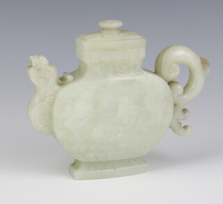An antique style Celadon jade flattened ovoid phoenix wine pot and cover with rounded body, the spout in the form of a head and tail of a phoenix 14.5cm 