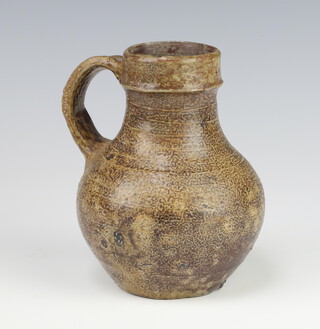A 17th/18th Century tiger ware jug 13cm 