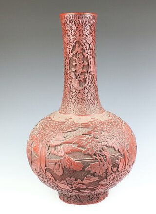 An impressive 19th Century Qing Dynasty cinnabar lacquered bottle vase, decorated with panels of scholars and children in gardens in a rocky river landscape, with panels of lotus, prunus, peony and chrysanthemums 60cm h  
