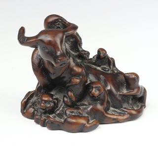 An 18th/19th Century fruitwood carving of a buffalo surrounded by monkeys, lions, shi shi, horses and beasts 10cm 