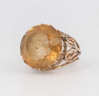 A yellow metal smoky quartz dress ring, 11 grams, size L 