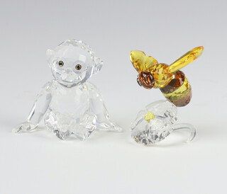 A Swarovski Crystal figure of a bee sitting on a flower 5.5cm, ditto of a seated chimpanzee 4.5cm, boxed 