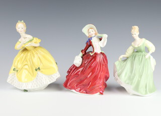 Three Royal Doulton figures - Autumn Breezes HN1934 19cm, Fair Lady HN2193 14cm and The Last Waltz HN2315 14cm 