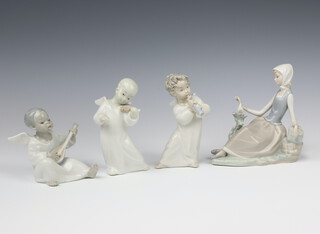 A Lladro figure of a seated angel musician 11cm, a standing ditto 16cm, another 15cm and a lady seated with a dove 16cm 