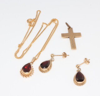 A 9ct yellow gold garnet set pendant and chain, a pair of ditto earrings and a cross, 8.7 grams gross 