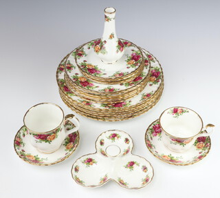 A Royal Albert Old Country Roses pattern part tea and coffee service, comprising 6 coffee mugs, 6 tea cups, 6 saucers, 6 small plates, 6 side plates, 6 dinner plates, milk jug, sugar bowl, vase, shaped dish, pair of condiments, teapot stand, trefoil dish and 6 soup bowls, all seconds 