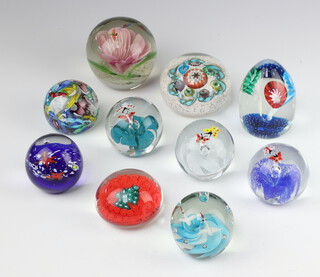 A Murano style millefiori paperweight 8cm and 9 similar paperweights 
