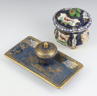A 19th Century Worcester style twin handled pot and cover having a blue and gilt ground with panels of flowers 8cm (minor chips to finial), together with a Spode chinoiserie style ink stand 20cm 