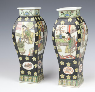 A pair of antique style black ground Chinese waisted oviform vases decorated with panels of figures at pursuits bearing a 6 character mark to the base 31cm 