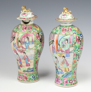 A pair of 19th Century famille rose oviform vases decorated with panels of figures at pursuits with dome lids, having dragon finials 27cm 
