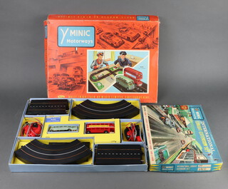 A Triang M.152 Public Transport Y Minic Motorway track game boxed,together with Minic No.1531 International Circuit Extension Set boxed  (both boxes showing signs of deterioration) 