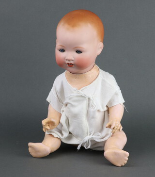 An Armand Marseille bisque headed doll stamped AM Germany 351 4/6.K, having open and closing eyes and articulated limbs 