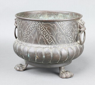 William Soutter and Sons Company, a Victorian embossed copper twin handled jardiniere with demi reeded decoration, raised on paw supports 20cm h x 25cm diam. 