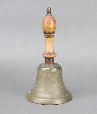 A brass hand bell with turned wooden handle 23cm h x 12cm diam. 