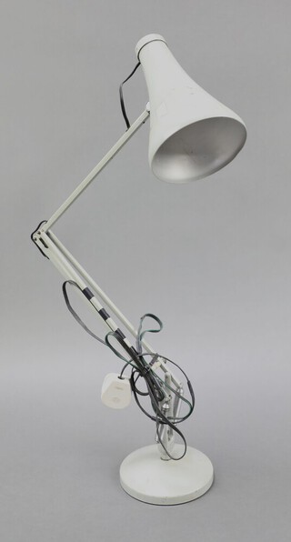 A Model 75 (1968 - 1973) grey metal anglepoise lamp on a circular base the base with oval embossed stamp in the fork "Made in England by Herbert Terry & Sons Ltd Redditch" and "Anglepoise Trade mark" on reverse, approx 87cm high
