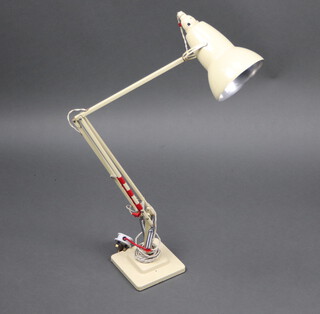 A Model 1227 (1938-1968) Anglepoise articulated lamp in cream, on a two tier square stepped base, the base of the fork with square embossed stamp of "The Anglepoise PAT in UK and abroad" and reverse "Made in UK by Herbert Terry and Sons Ltd Redditch" approx 87 cm high 