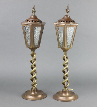 A pair of 1930's brass and glass hexagonal shaped lanterns raised on spiral turned columns and circular bases 47cm x 12cm 