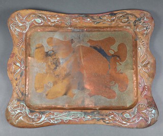 An Art Nouveau rectangular embossed copper tray 70cm x 56cm 
