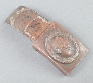 A Second World War Luftwaffe buckle with small section of leather, the leather marked Menden 